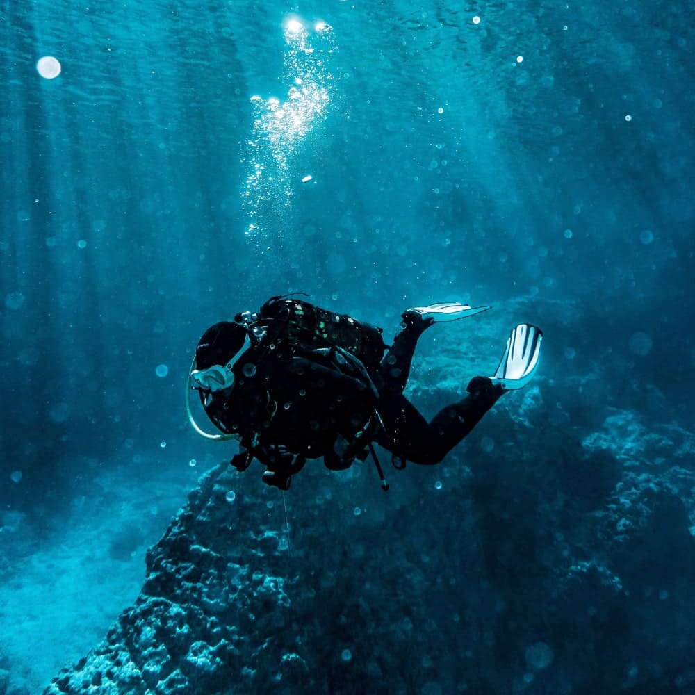 Scuba diver underwater during FAQ illustration